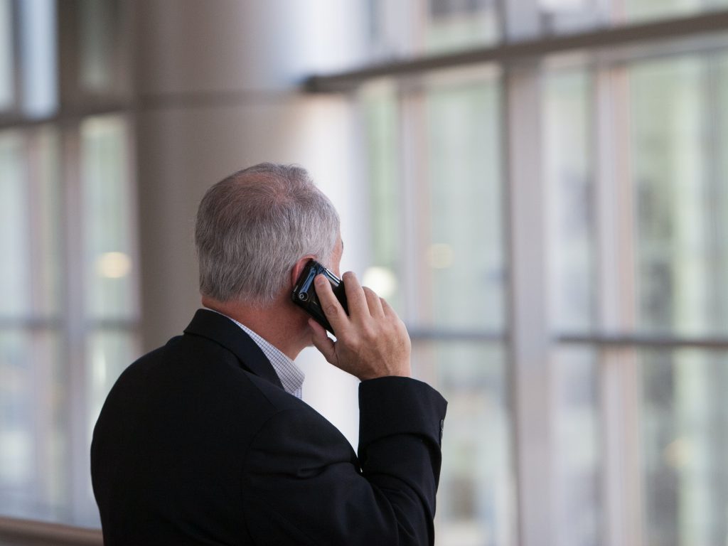 a guy calling someone on the phone